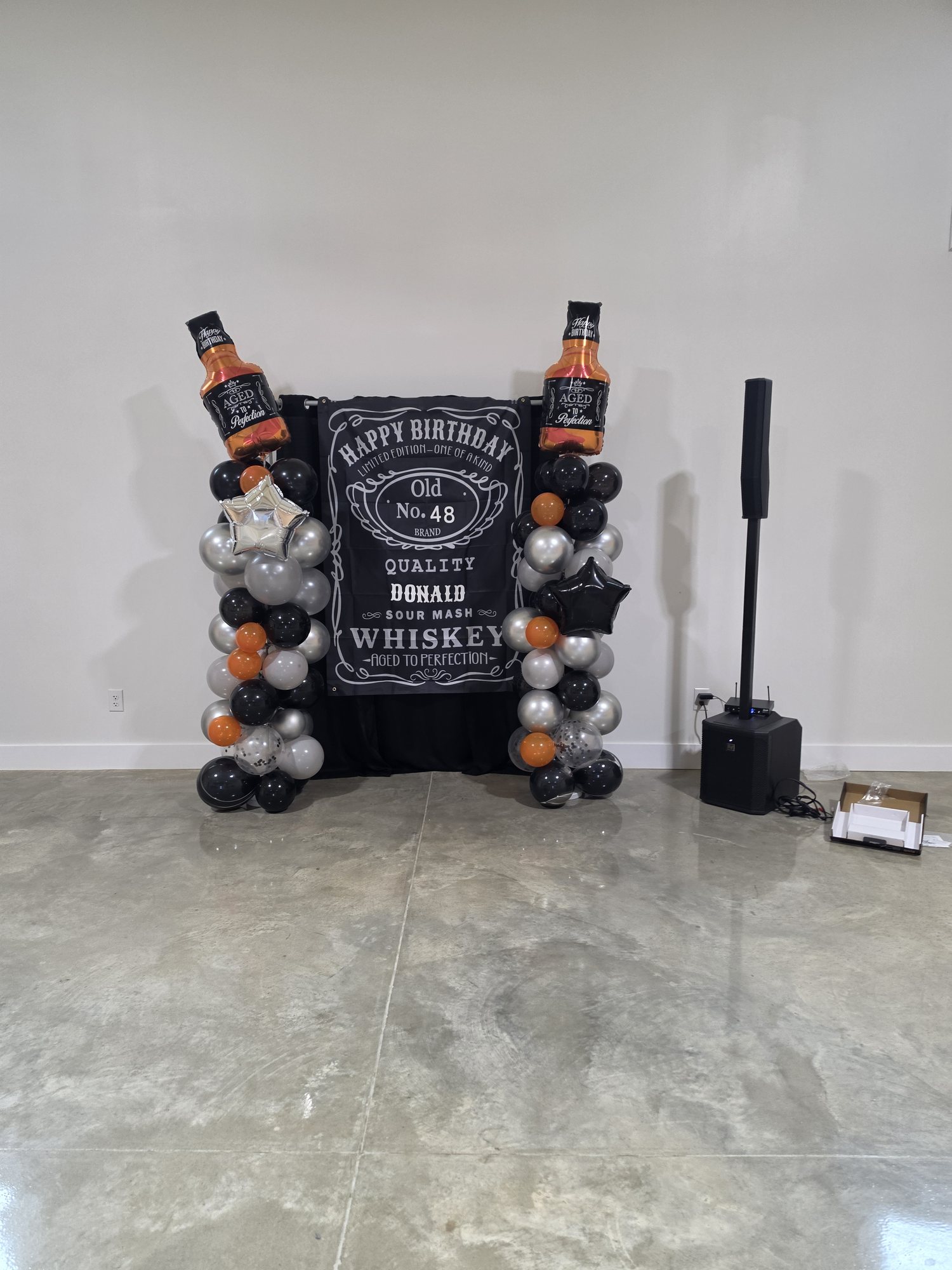 A custom birthday backdrop arranged inside The Landing